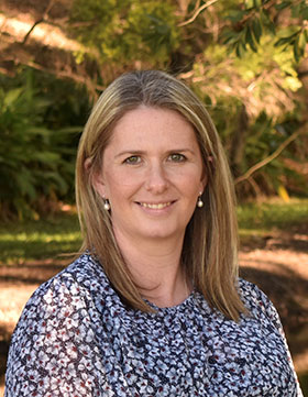 Dr Laura Baxter, blonde woman wearing floral shirt