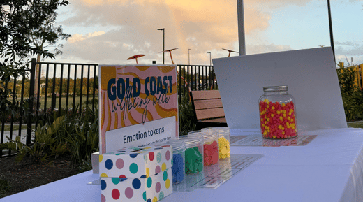 Emotion tokens and a rainbow at Gold Coast Wellbeing Week 2026.